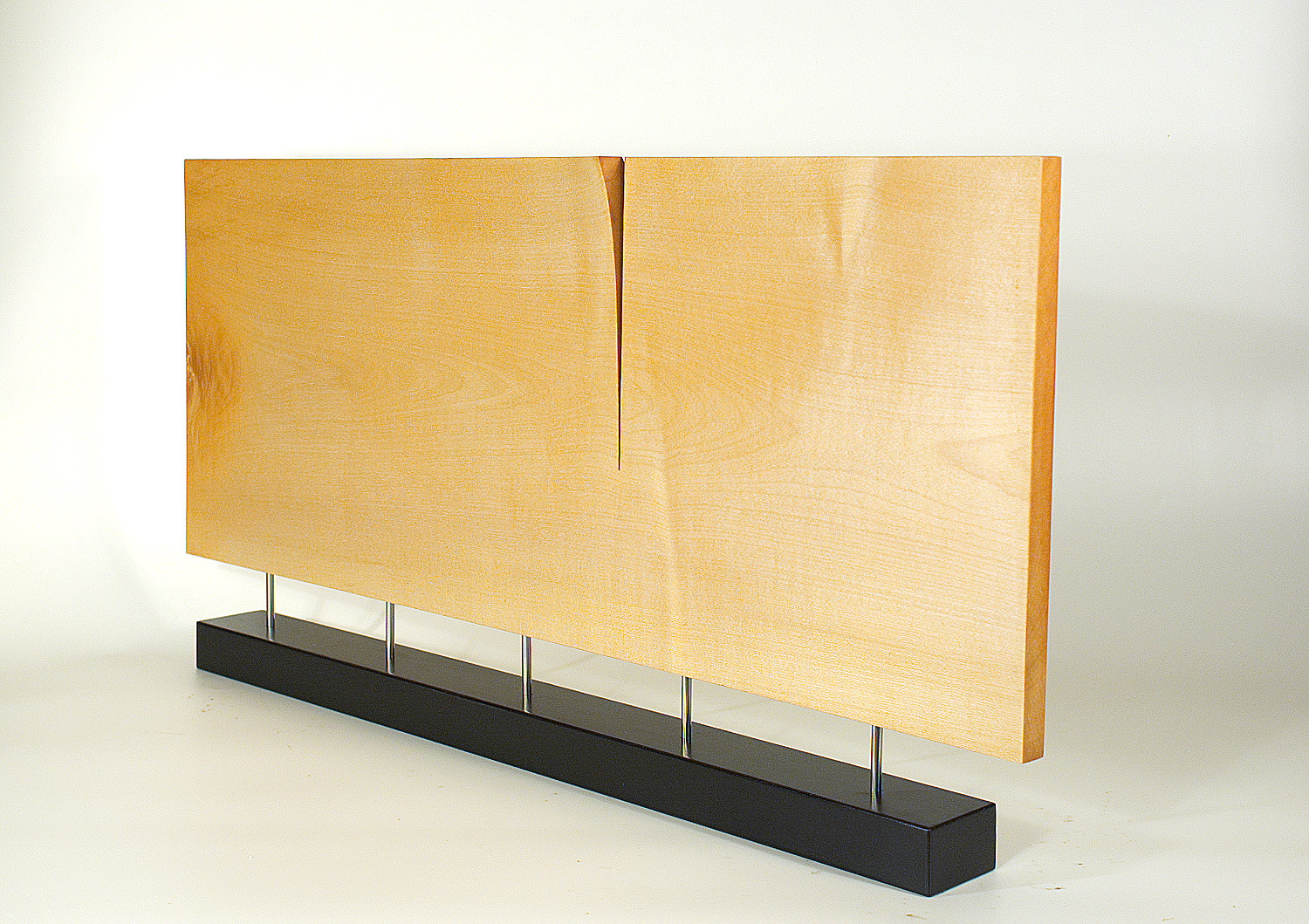 Modern sculpture in wood. Original in sycamore and stainless steel. 