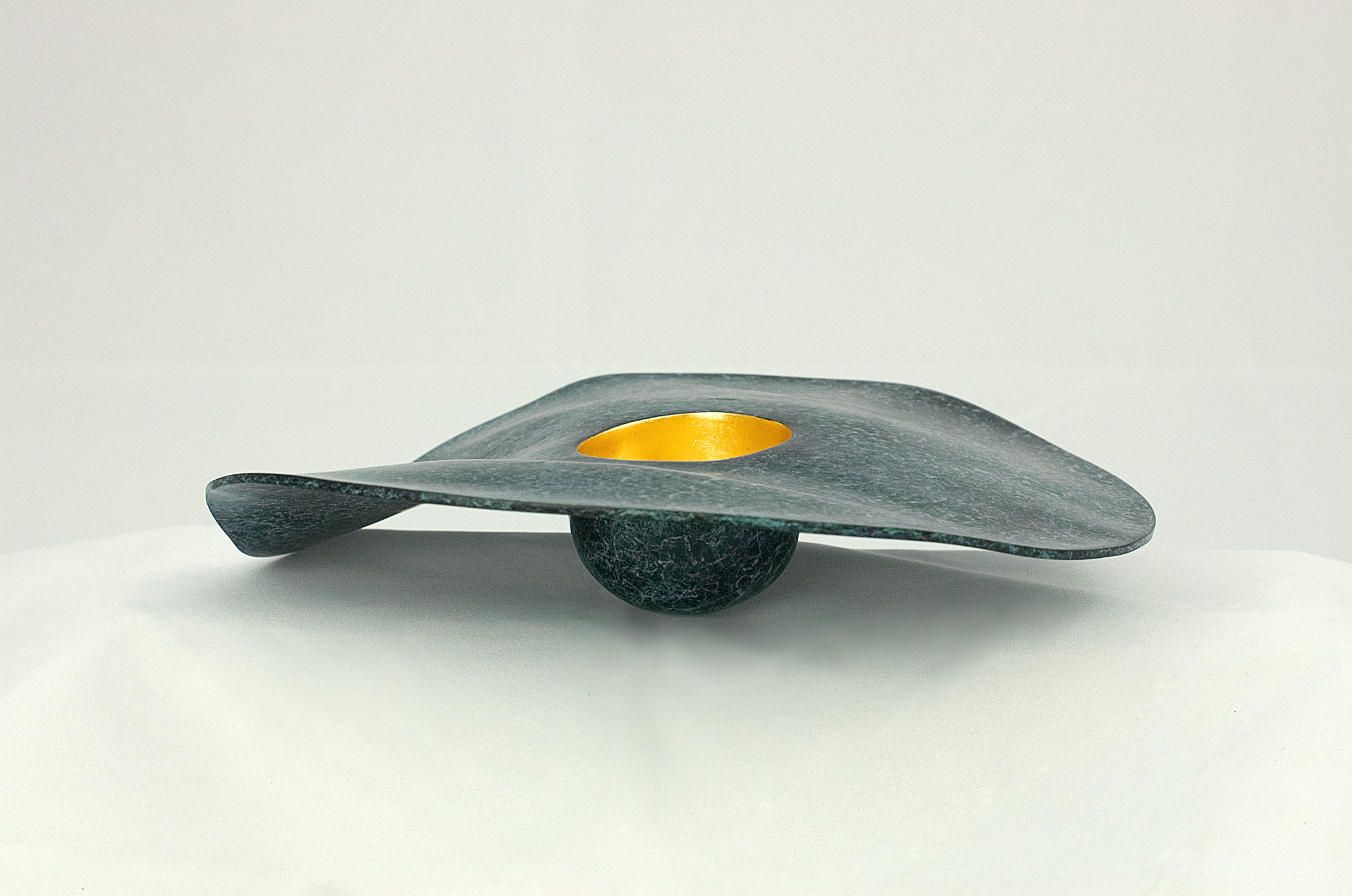 Modern sculpture in bronze. Wide rimmed bowl with the inside of the bowl gilded in 23.5 carat gold. 27 x 5 cms. 2018. One of an edition of 8.